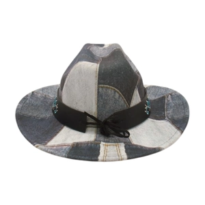 Detail view of denim patchwork cowboy hat with ethnic embroidery on leather band