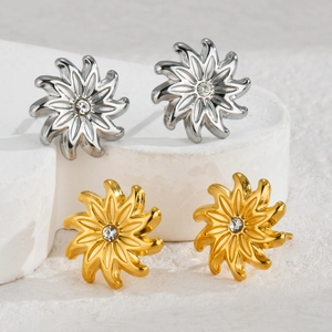 Bohemian 18k gold and silver sunflower stud earrings with central sparkling crystal