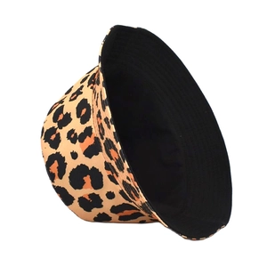 Detail of leopard print bucket hat with black inner lining showing reversible feature