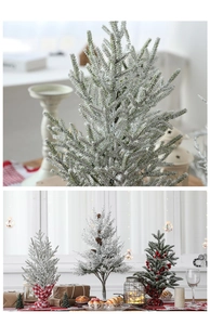 Detailed view of snowy mini Christmas trees with pine cones and berries on cloth bases