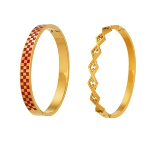 Golden geometric bangle set featuring red checkered enamel and hollow diamond crystal design