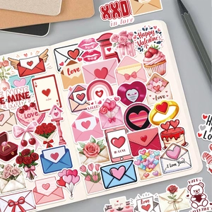 Close-up of Valentine stickers featuring hearts and envelopes on a white notebook page
