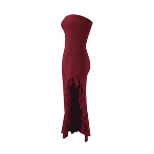 Detailed view of the ruffle high slit and hemline of a burgundy strapless gown