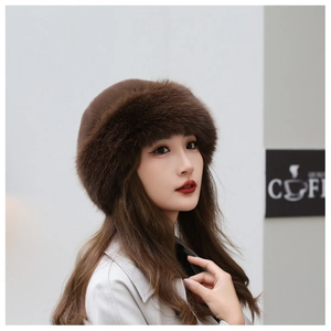 Detailed close-up of dark brown faux fur texture on a warm Russian style winter hat