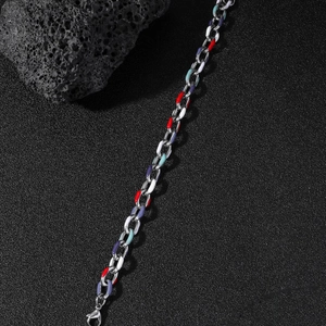 Colorful enamel stainless steel chain bracelet with lobster clasp on black rock background