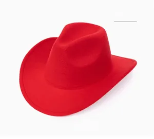 Detail of bright red wool felt cowboy hat with wide brim and classic pinched crown