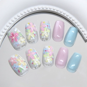 Floral cat eye press-on nails set with pink and blue hand-painted flower designs
