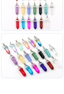 Detailed view of various colorful hexagonal crystal pendants with metal ring hooks