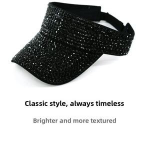 Detail of adjustable back strap on black sun visor hat with sparkling rhinestones