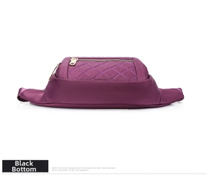 Detail of purple quilted waist bag with black base and smooth golden zipper closure