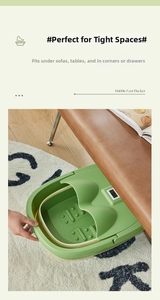 Collapsible green foot bath basin tucked neatly under a sofa for space-saving storage