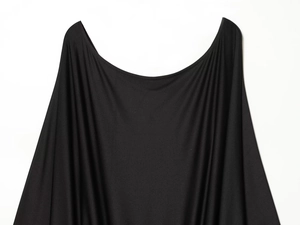 Detail of a black mini dress featuring a draped U-neckline and smooth satin fabric