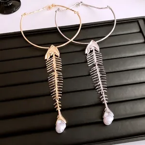 French style fishbone pendant necklace set in gold and silver with pearl detail