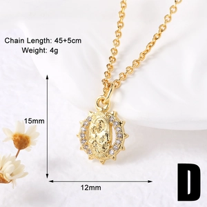 Detailed close-up of a gold-plated religious pendant with cubic zirconia on a link chain