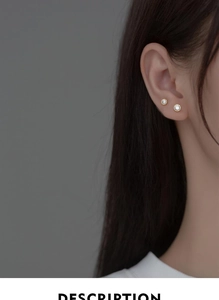 Close-up of minimalist s925 silver round stud earrings with sparkling cubic zirconia