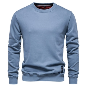 Detail of light blue crewneck sweatshirt showing the ribbed neckline and size S label