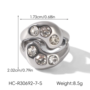 Detail view of wave-shaped silver ring with dimensions and zircon inlay features