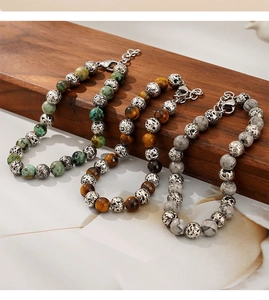 Detailed shot of tiger eye and turquoise beaded bracelets with metallic accents