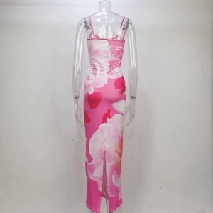 Detail view of pink floral maxi dress featuring a high back slit and spaghetti straps