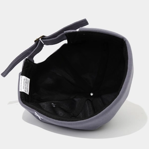 Detailed close-up of 100% cotton inner lining and adjustable strap on a gray Miki hat