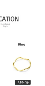 Detailed view of the wavy 18K gold plated titanium ring with minimalist design lines