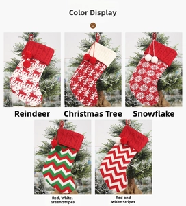Detail display of five knit Christmas stockings with reindeer and snowflake patterns