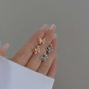 Minimalist titanium steel butterfly studs in gold and silver with frosted texture