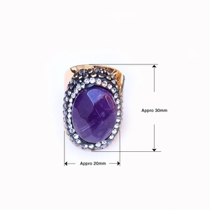 Detailed view of faceted purple agate ring with dimensions approx 30mm by 20mm