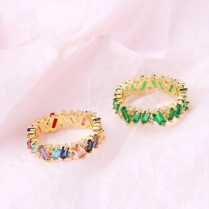 Detail showing 18K gold plated rings with colorful and emerald green zircon stones