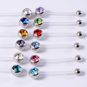 Detail shot of multi-colored crystal navel rings with flexible soft acrylic bars