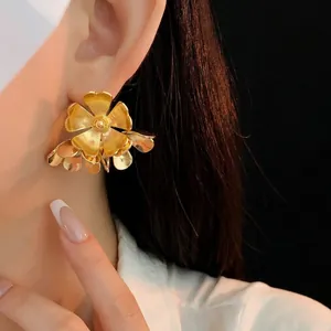 Chic oversized layered floral stud earrings in golden finish with 3D petal design