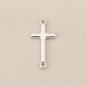 Detailed view of silver-plated cross connector with dual rings for DIY jewelry crafting