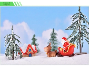 Miniature Christmas set with Santa, reindeer, sled, and snowy trees for dioramas