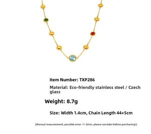 Detailed view of gold chain necklace with colorful glass beads and size measurements