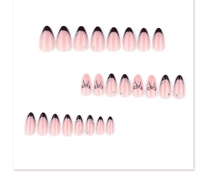 Detailed set of almond French nails with black tips and delicate bow accents