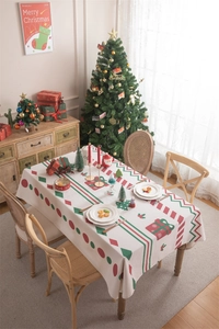 Detailed view of Christmas festive tablecloth with red and green geometric patterns