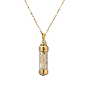 Golden perfume bottle pendant necklace with yellow crystal stones on a clean white background
