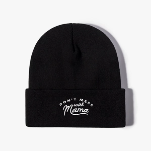 Classic black knit beanie with Don't Mess With Mama white embroidery on a cuffed brim