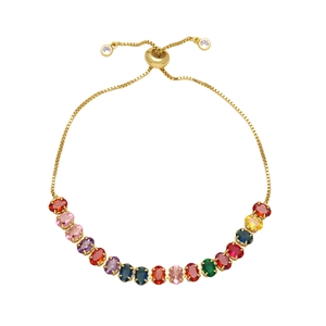 Adjustable gold bracelet featuring a row of vibrant colorful oval cubic zirconia stones