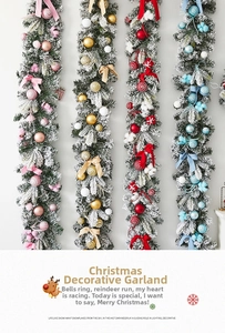 Detail of flocked Christmas garland with bows and ornaments in pink, gold, red and blue
