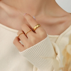 Three-piece 18K gold plated ring set with zircon stars and bamboo texture on hand