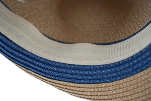 Close-up of weave texture and sweatband on this Panama straw sun hat for beach trips