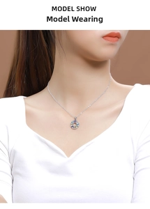 Close-up of a 925 silver rainbow pendant necklace worn by a model on a brown background