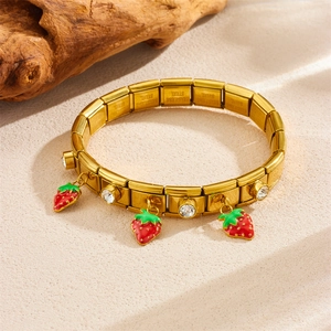Gold stainless steel charm bracelet with red strawberry enamel pendant and white cubic zirconia