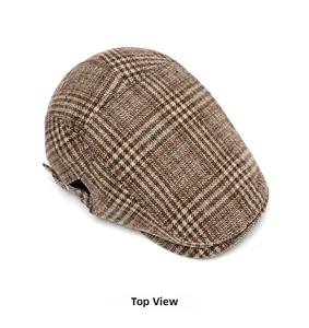 Detailed top view showing the intricate plaid texture of the vintage tweed flat cap