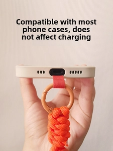 Universal orange braided phone wrist strap showing unobstructed charging port access