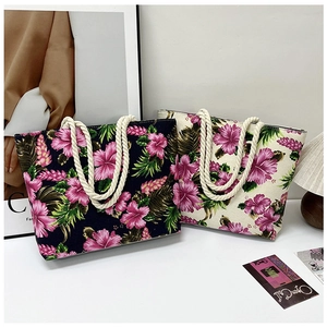 Close-up of tropical floral print canvas tote bags with durable rope handles