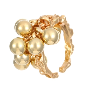Gold irregular textured open ring featuring a cluster of polished gold beads
