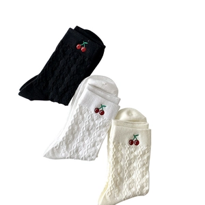 Black and white mid-calf cotton socks with cherry embroidery and cable knit texture