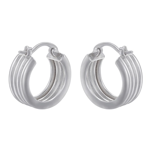 Macro shot of silver-colored ribbed oval hoop earrings with a metallic finish and buckle